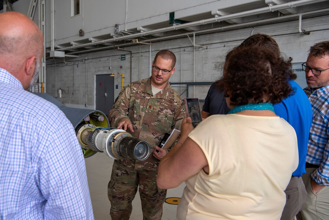 U.S. Air Force Maj. Dale Ellis, the 6th Maintenance Squadron commander, explains the technology behind the boom during an honorary commander immersion tour at MacDill Air Force Base, Fla., Dec. 12, 2019. The Honorary Commander Program helps foster a supportive relationship between the community and the Air Force by providing opportunities to share experiences.