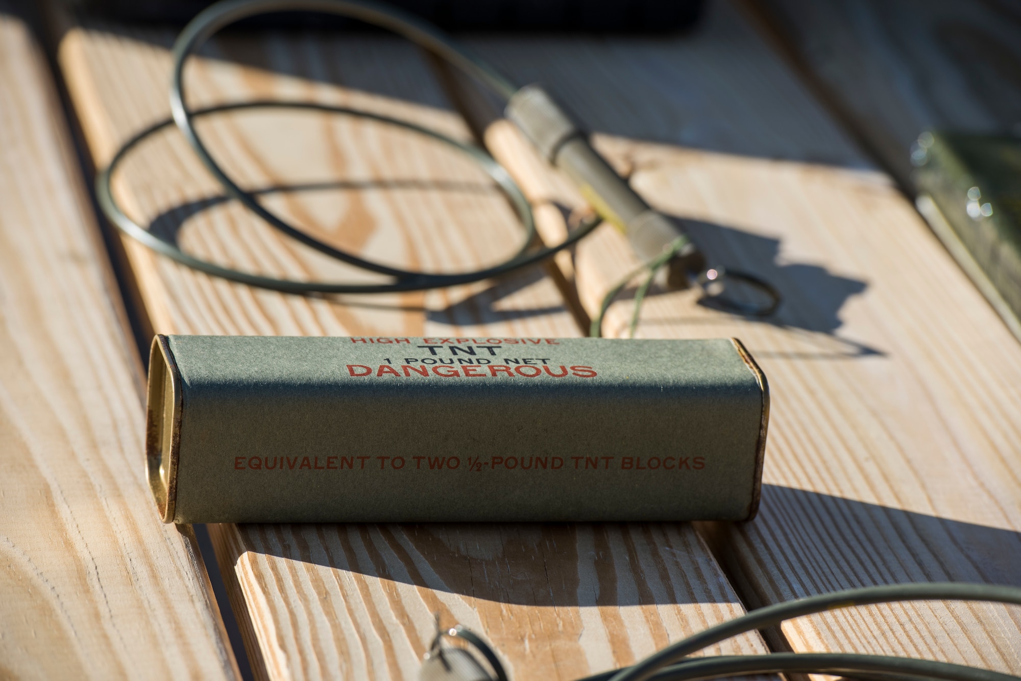 A stick of trinitrotoluene (TNT) awaits detonation