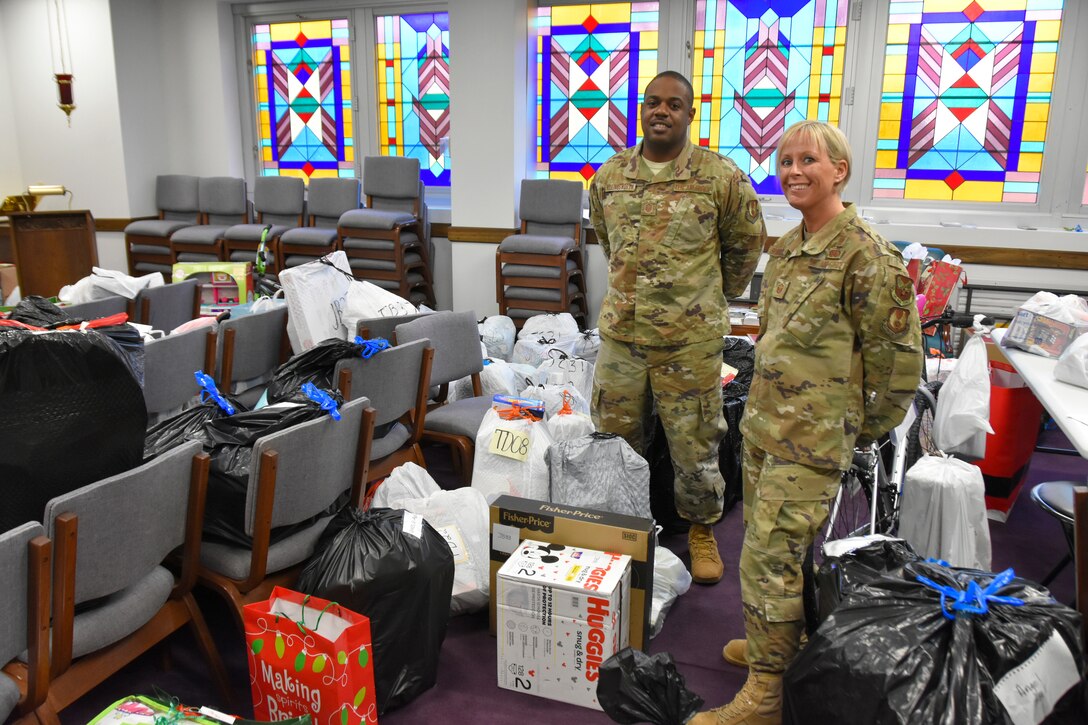 Master Sgt. Ricardo Hollingsworth and Master Sgt. Beverly Spademan are surrounded by the toys dropped off in the Arnold Air Force Base Chapel during the 2019 AEDC Angel Tree program. For the second consecutive year, Hollingsworth and Spademan coordinated the program. All 135 children on the Arnold AFB Angel Tree list this year were sponsored by personnel from across the base. (U.S. Air Force photo by Bradley Hicks)