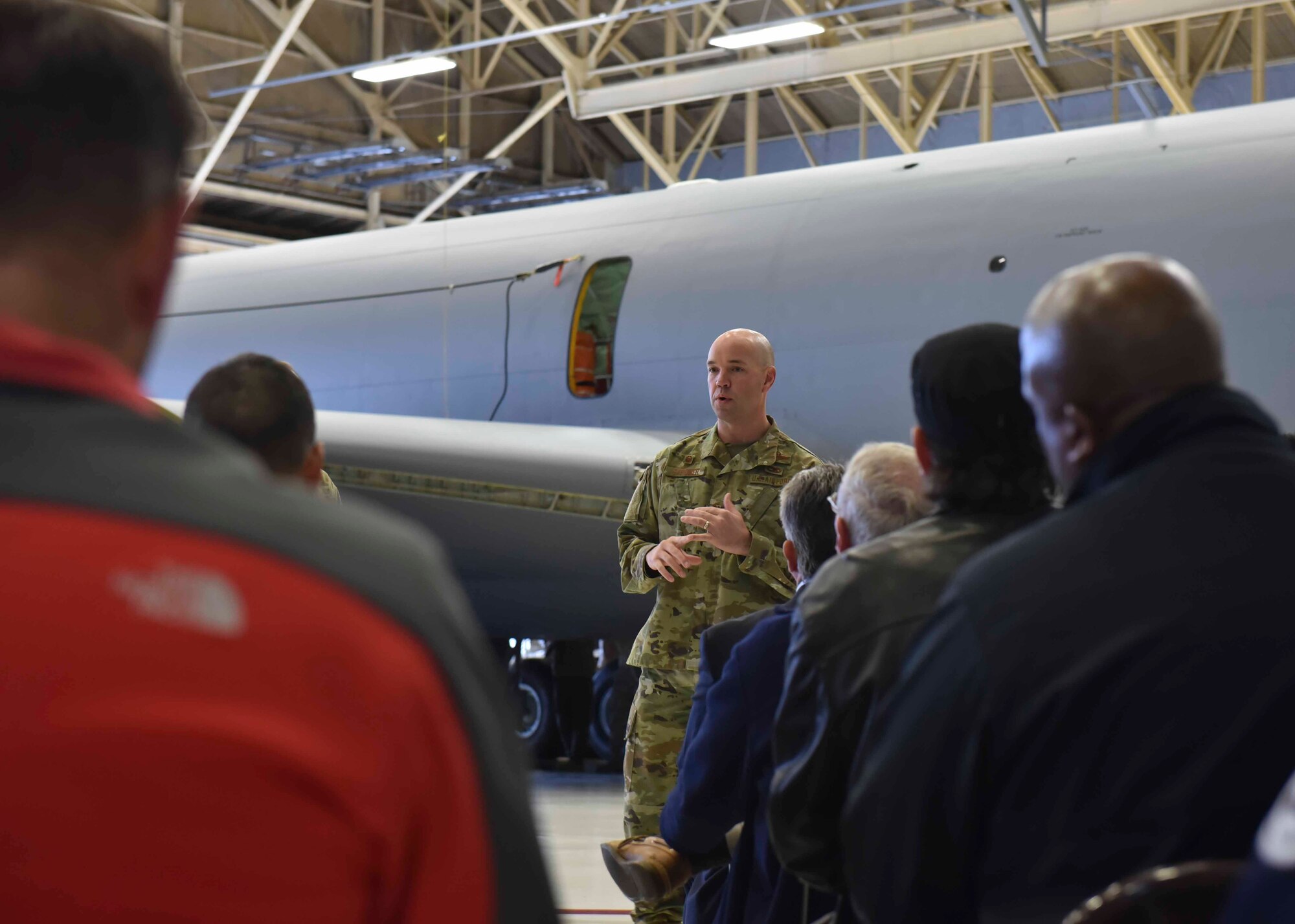 U.S. Air Force Col. Larry Gardner, 141st Air Refueling Wing commander, welcomes members from the Department of Defense Maintenance Symposium to Fairchild Air Force Base, Washington, Dec 12, 2019. Team Fairchild hosted a DoD Maintenance Symposium tour to showcase Condition Base Maintenance Plus, Theory of Constraints and innovations implemented. (U.S. Air Force photo by Airman 1st Class Kiaundra Miller)