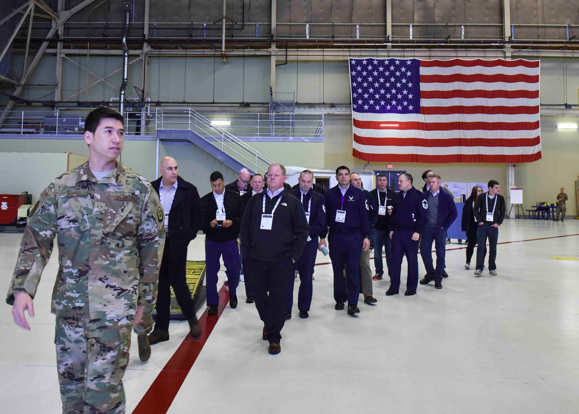 A 92nd Air Force Aircraft Maintenance Squadron Airman provides a tour to members from the Department of Defense Maintenance Symposium at Fairchild Air Force Base, Washington, Dec 12, 2019. The tour featured Fairchild’s implemented innovations and processes that save the Air Force man hours and money. (U.S. Air Force photo by Airman 1st Class Kiaundra Miller)