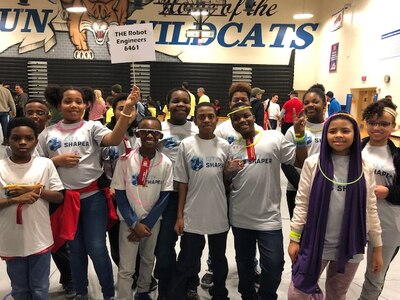 IMAGE: RICHMOND, Va. (Nov. 23, 2019) - Members of the FIRST Lego League team called ‘The Robot Engineers’ are pictured during the Glen Allen Regional Tournament held at Deep Run High School. The team – comprising ten grade-school students from multiple public and home-school districts in metro-Richmond – received the first place Innovation Project Award for their solution to combat homelessness. Naval Surface Warfare Center Dahlgren Division employees Serita Seright, Joycelyn Josey-Harris and Tiffany Owens helped mentor the team.