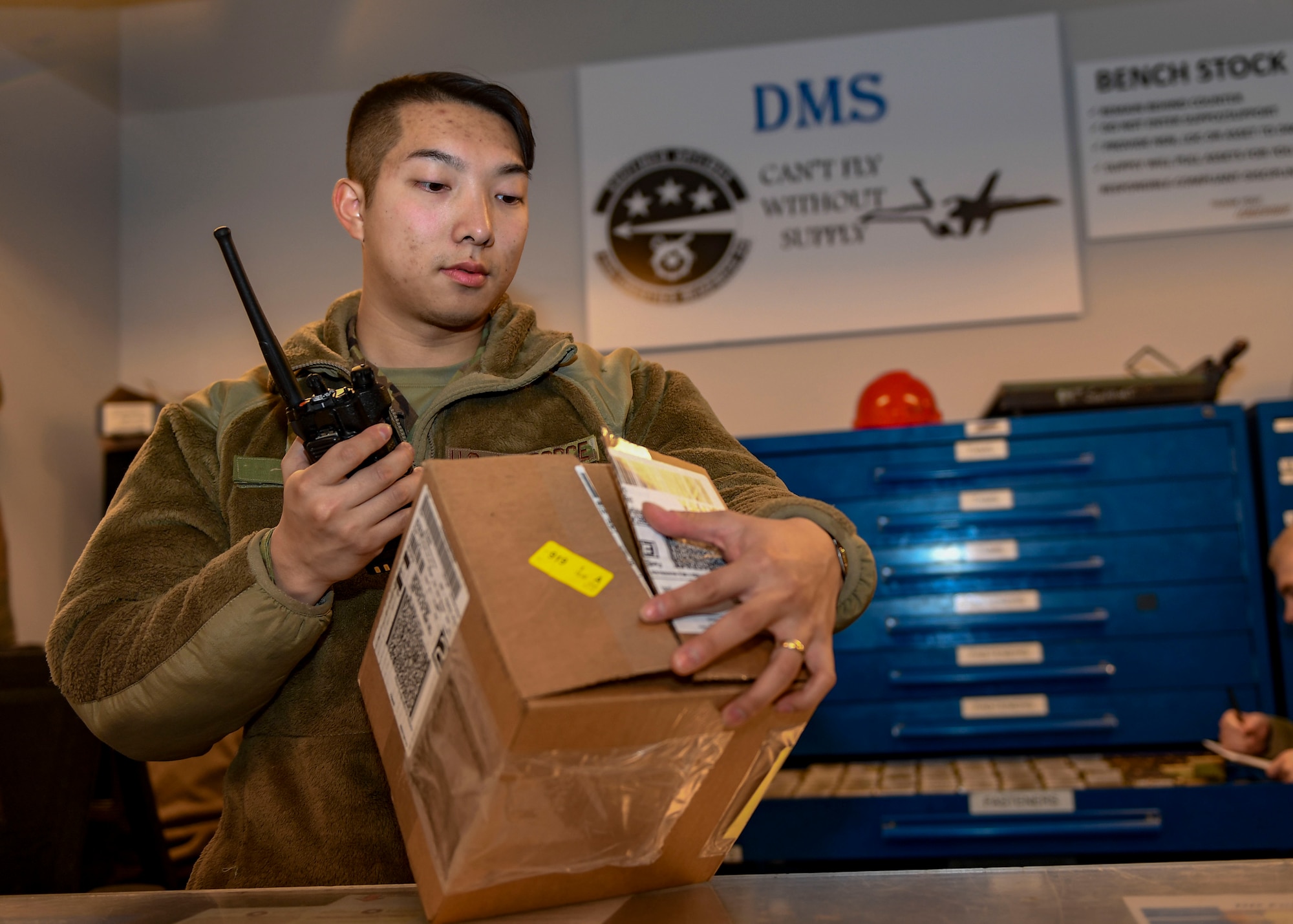 U.S. Air Force Senior Airman Andy Vo, decentralized materiel support technician, checks inventory at Joint Base Langley-Eustis, Virginia, Dec. 13, 2019.