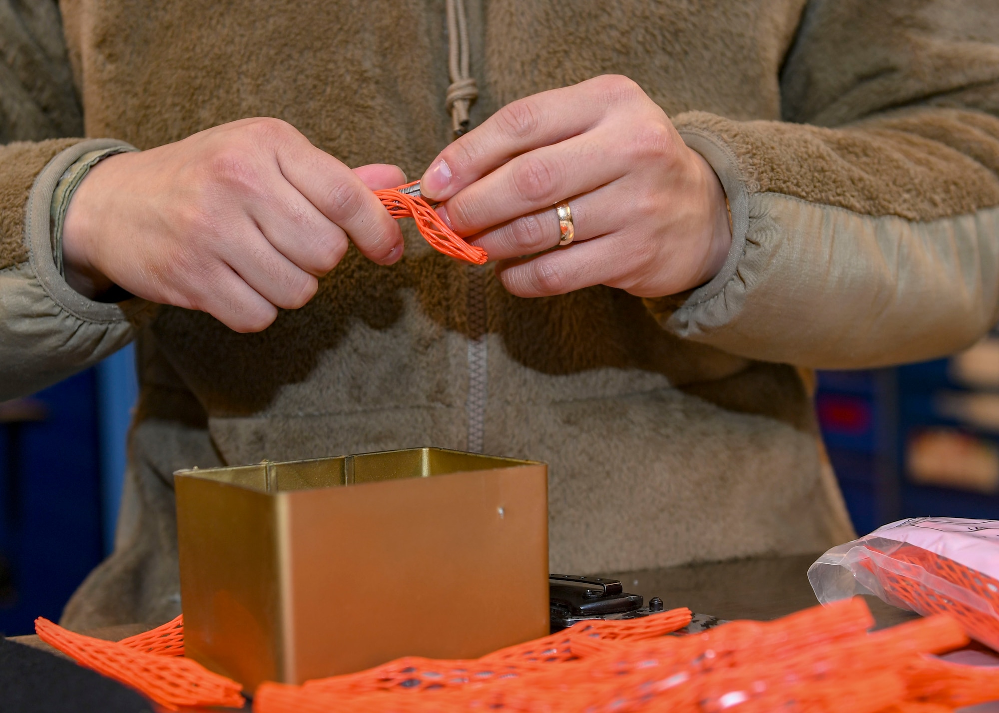 U.S. Air Force Senior Airman Andy Vo, decentralized materiel support technician, puts inventory into boxes at Joint Base Langley-Eustis, Virginia, Dec. 13, 2019.