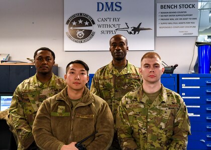 The decentralized materiel support team swing shift poses for a photo at Joint Base Langley-Eustis, Virginia, Dec. 13, 2019.