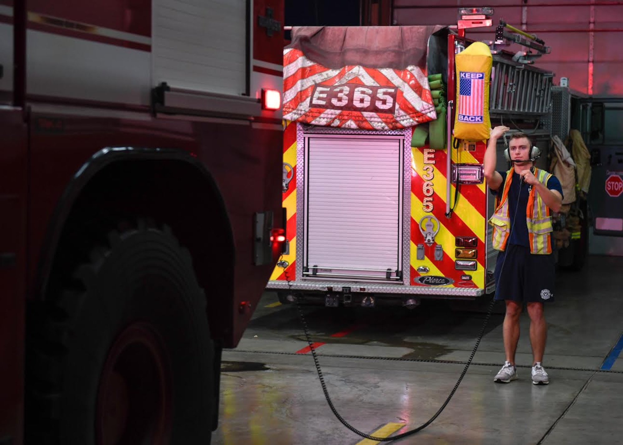 Airman 1st Class Jared Schmidt, 56th Civil Engineer Squadron firefighter, guides a P-23 Aircraft Rescue Fire Fighting (ARFF) vehicle into the fire station Dec. 8, 2019, at the Luke Air Force Base Fire Department, Ariz.