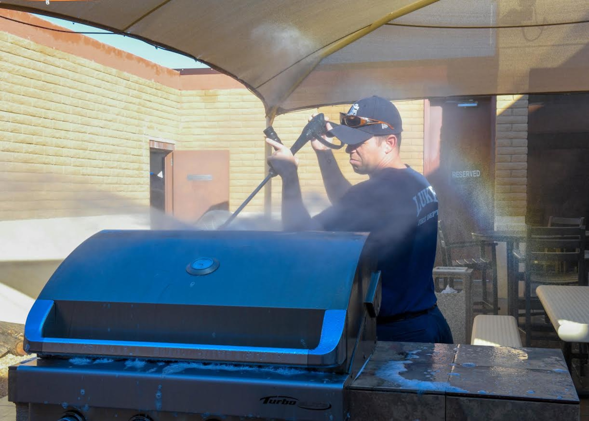 Paul Haidinger, 56th Civil Engineer Squadron lead firefighter, works on a cleaning detail Dec. 9, 2019, at the Luke Air Force Base Fire Department, Ariz.