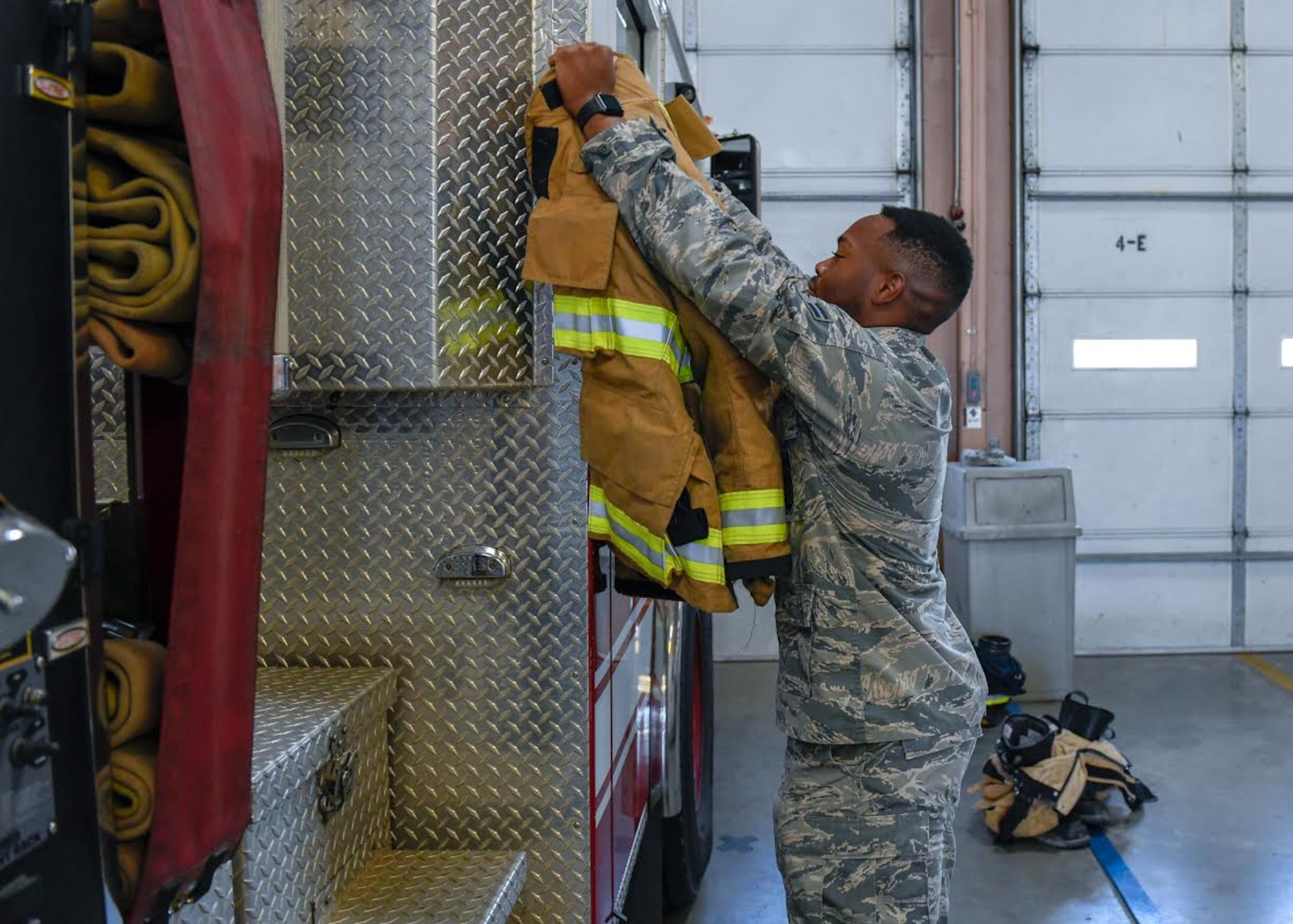 After responding to a car accident, Airman 1st Class Emmanuel Willis, 56th Civil Engineer Squadron firefighter, repositions his turnout gear for the next call Dec. 9, 2019, at the Luke Air Force Base Fire Department, Ariz.