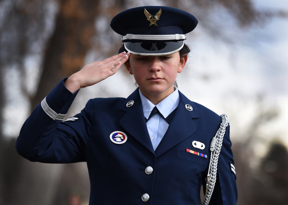 Airman 1st Class Tiffany Rios, Mile High Honor Guard ceremonial guardsman, renders a salute after placing a wreath on a veteran’s grave at the Wreaths Across America (WAA) event at Fairmount Cemetery in Denver, Dec. 14, 2019.