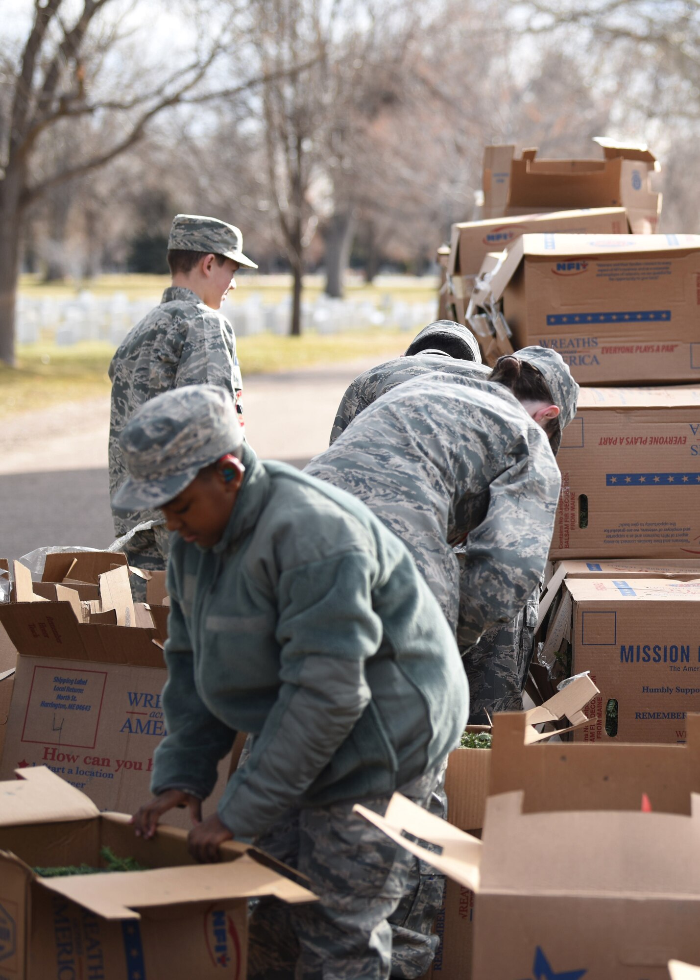 Cadets from Civil Air Patrol Mile High Squadron 143 sort wreaths for the Wreaths Across America event at Fairmount Cemetery in Denver, Dec. 14, 2019.