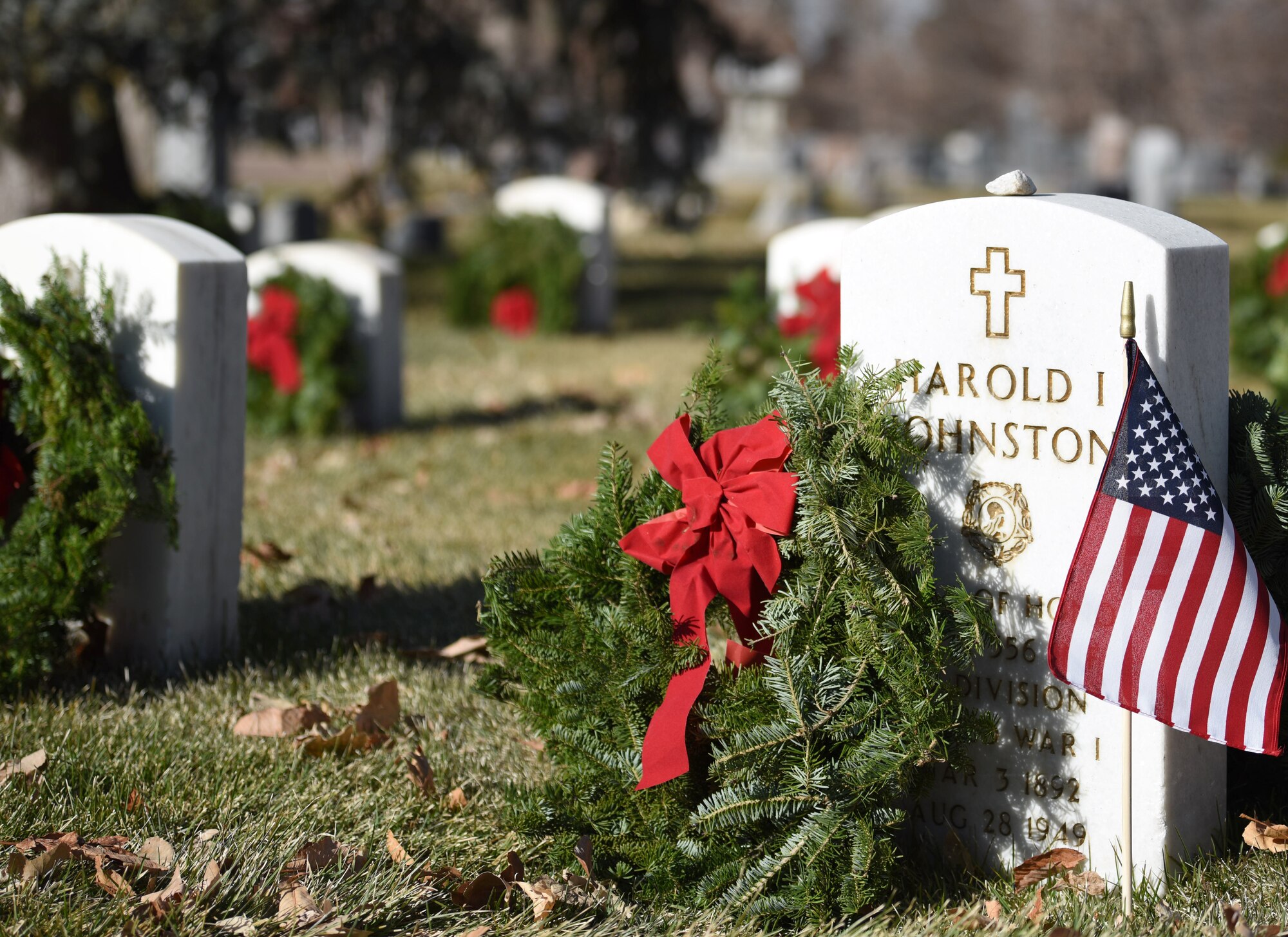 Volunteers placed wreaths on the graves of fallen service members at the Wreaths Across America event at Fairmount Cemetery in Denver, Dec. 14, 2019.