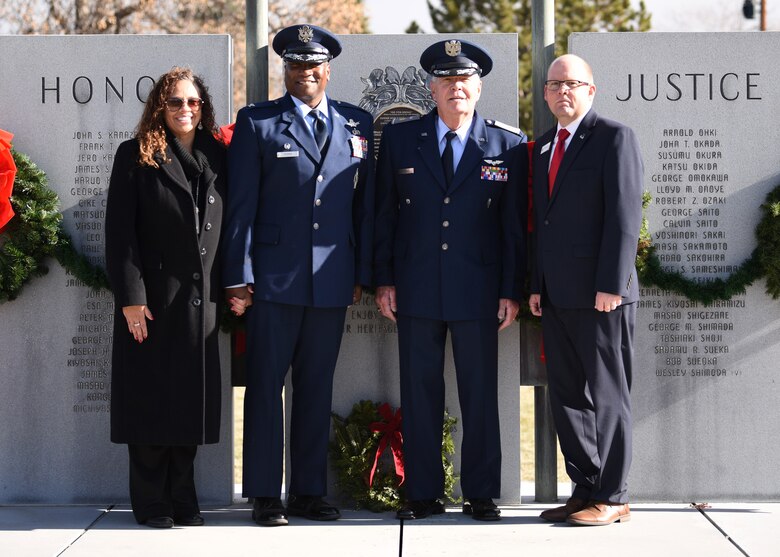 From left to right, Alicia Pepper, 460th Space Wing commander’s spouse, Col. Devin Pepper, 460th SW commander, Maj. Norm Teltow, Civil Air Patrol Mile High Squadron 143 commander, and Michael Long, Fairmount Cemetery director of business development, pose in front of a monument at Fairmount Cemetery in Denver, Dec. 14, 2019.