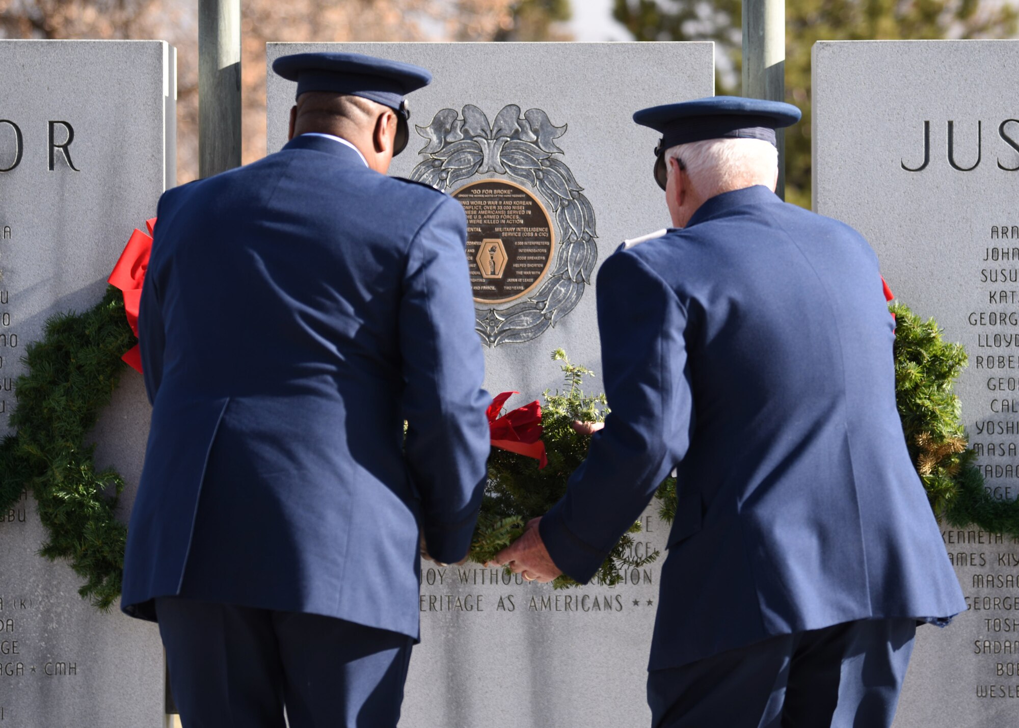 Col. Devin Pepper, 460th Space Wing commander (left), and Maj. Norm Teltow, Civil Air Patrol Mile High Squadron 143 commander (right), place a wreath on a memorial at Fairmount Cemetery in Denver, Dec. 14, 2019.