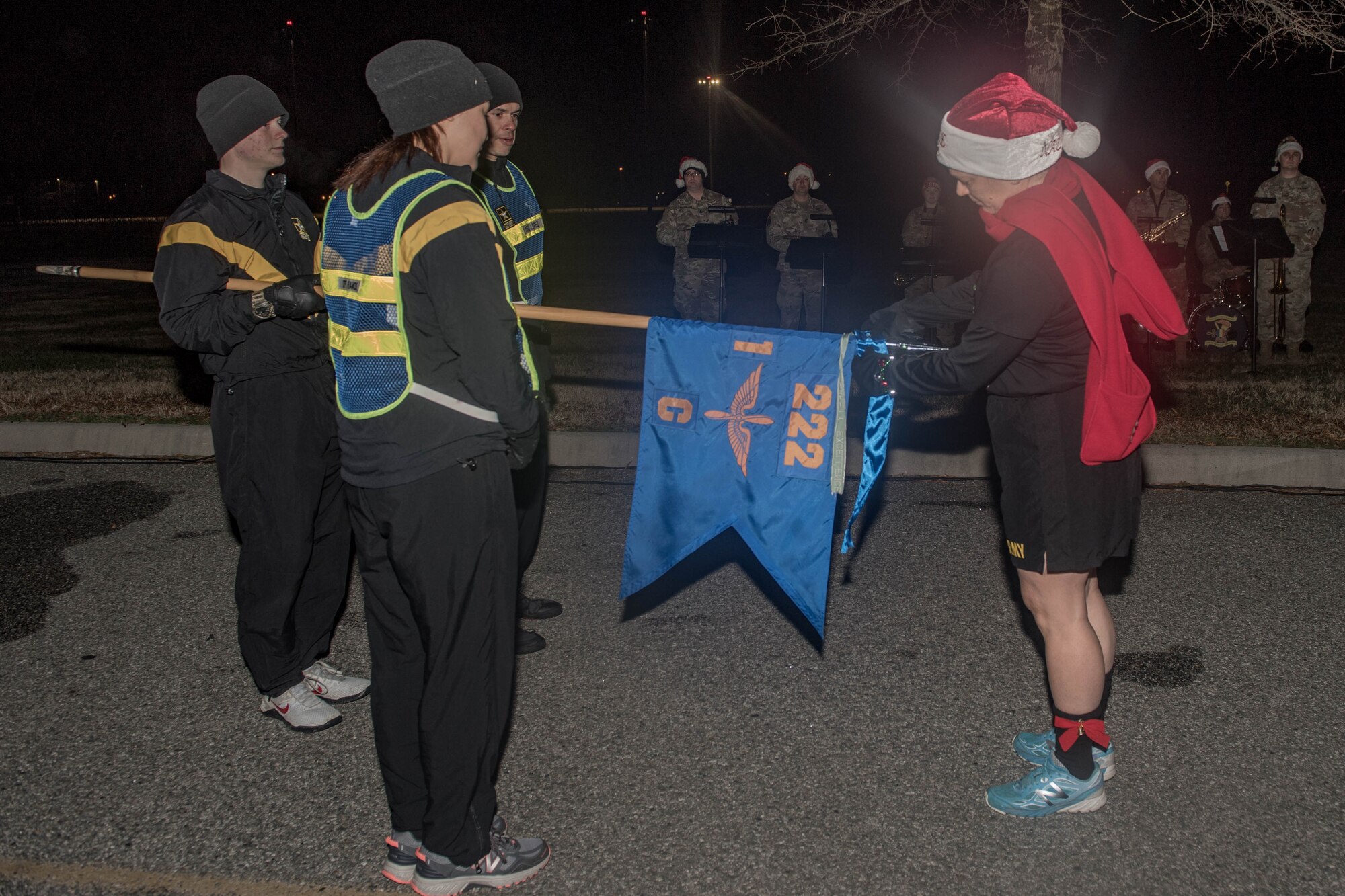 U.S. Army Col. Jenn Walkawicz, 733rd Mission Support Group commander, gives a streamer to Soldiers assigned to Charlie Company, 128th Aviation Battalion, 128th Avn. Brigade, for donating the most toys during the Toys for Tots campaign at Joint Base Langley-Eustis, Virginia, Dec. 13, 2019. More than 2,000 Soldiers participated in the installation holiday 5K. (U.S. Air Force photo by Senior Airman Derek Seifert)