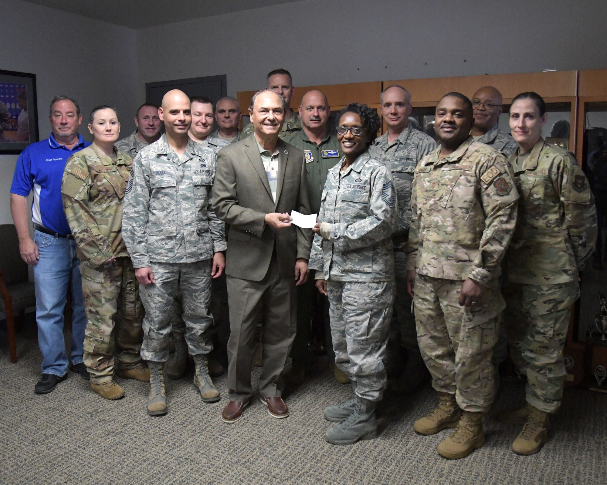 The Air Force Sergeants Association gave the Dobbins Chiefs Group a check for $300 on Dec. 6, 2019. The donation will go toward the Dobbins Chiefs Group Scholarship as well as other programs related to morale and welfare of enlisted Airmen at Dobbins, said Chief Master Sergeant Stephanie Gillis, 700th Airlift Squadron operations superintendent. (U.S. Air Force photo/Tech. Sgt. Andrew Park)