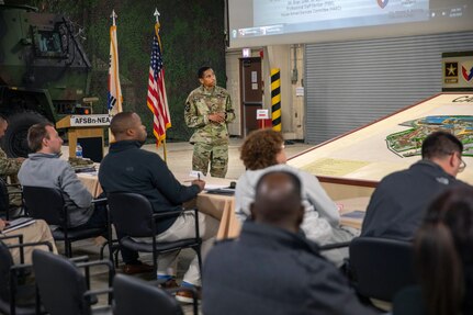 Col. Wheeler Manning, commander, 403rd Army Field Support Brigade, briefs congressional staff members Nov. 8.