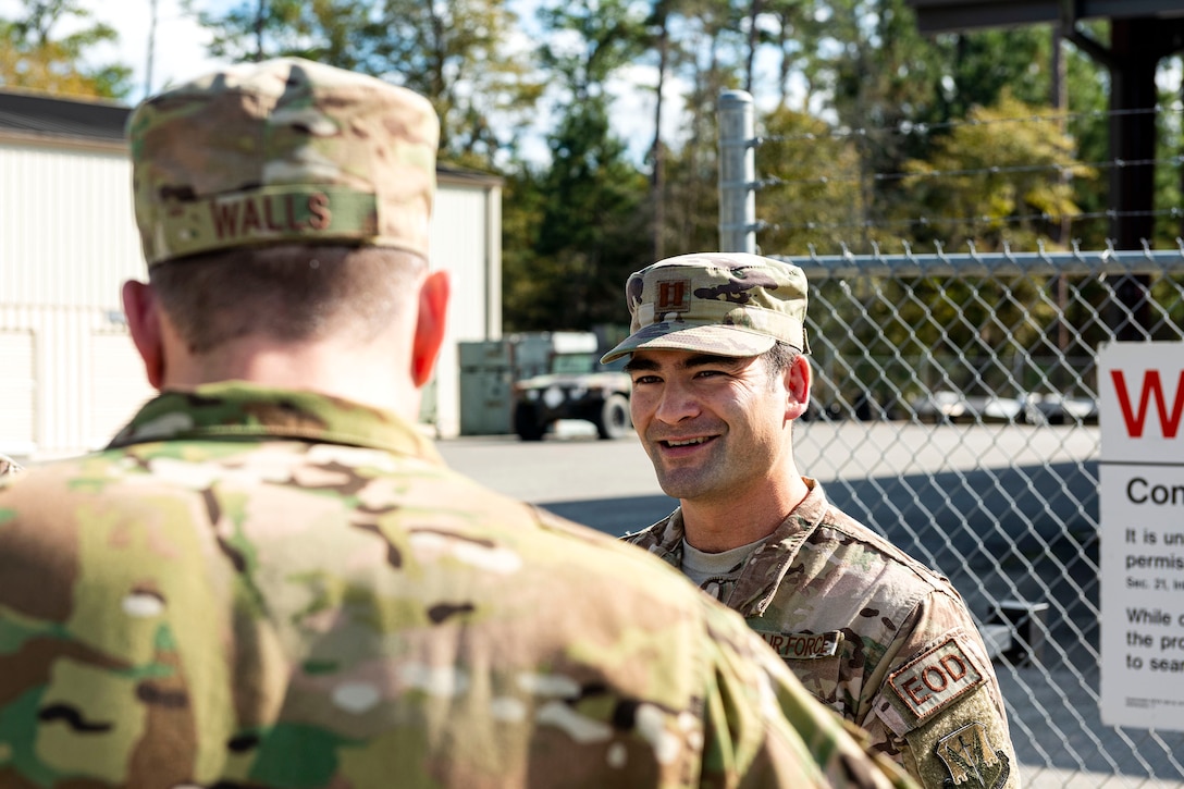 A photo of Capt. Akira Nervik speaking with Col. Dan Walls.