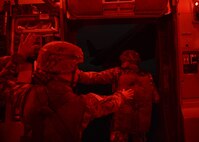 Two people simulate jumping out of an aircraft.