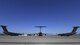 Three C-17 aircraft sit on a flightline.