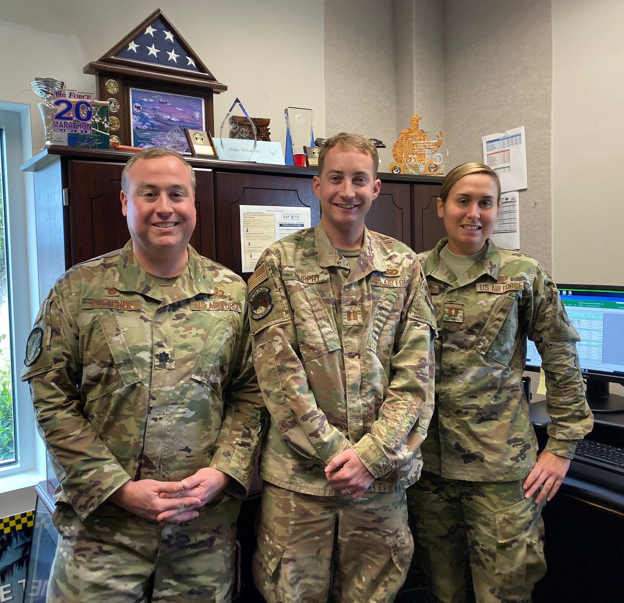 From left, Lt. Col. Steven Fletcher, 325th Contracting Squadron commander, Capt. Sean Murphy, 325th Civil Engineer Squadron deputy engineering flight chief, and Captain Meara McCarthy, 325th Comptroller Squadron budget officer, successfully allocated approximately $1 billion for Tyndall AFB during the final quarter of FY19.