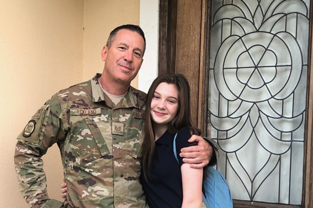 Tech. Sgt. Krekel Eckland, 41st Aerial Port Squadron air transportation specialist, poses for a photo with his daughter. (U.S. Air Force courtesy photo submitted by Tech.Sgt. Krekel Eckland, cropped photo)