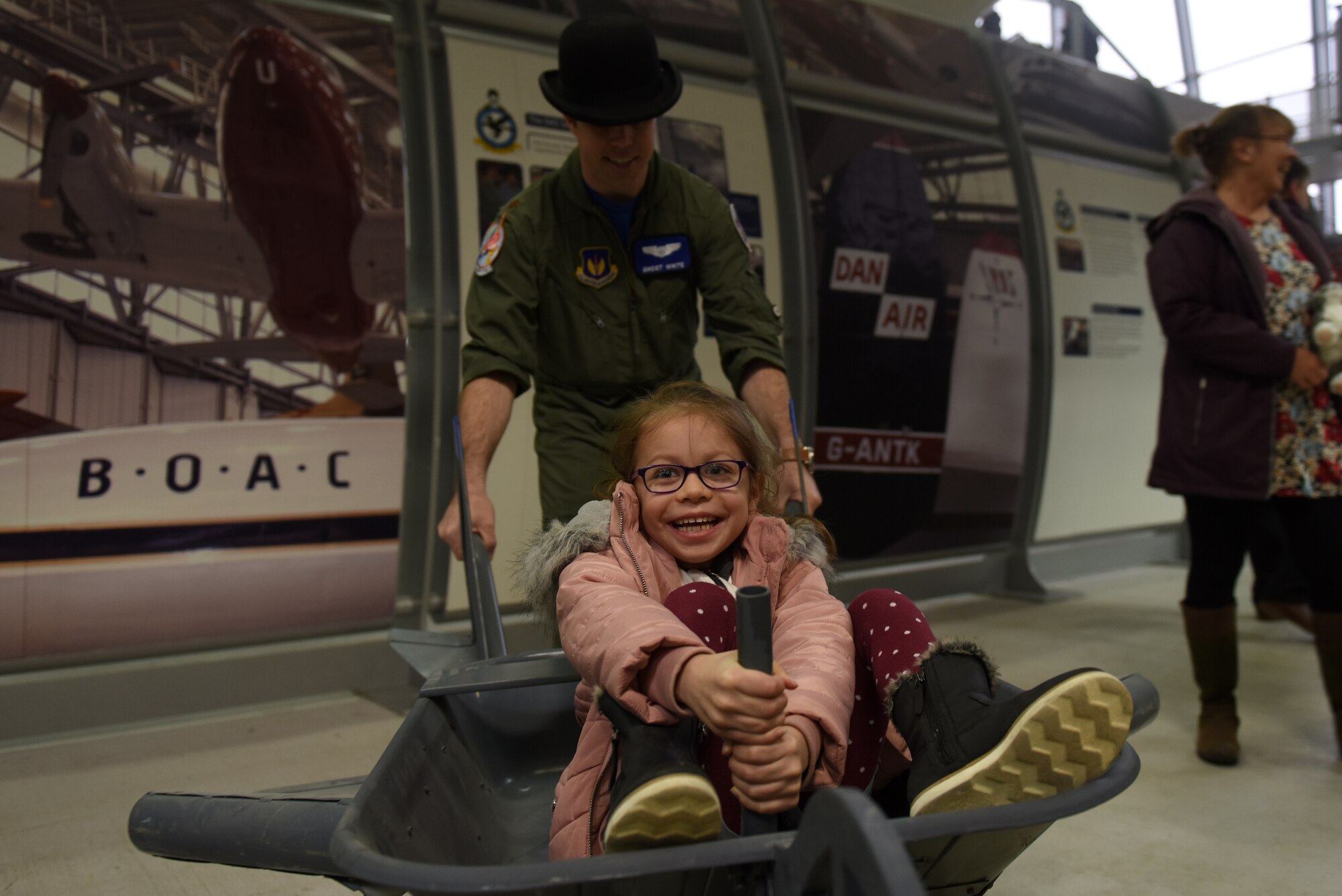 A child rides in an aircraft simulation device at the Duxford Children’s Christmas Party at the Imperial War Museum, Cambridgeshire, England, Dec. 14, 2019. The event featured games, Morse code lessons, pilot displays, and a visit from Father Christmas himself. (U.S. Air Force photo by Airman 1st Class Rhonda Smith)