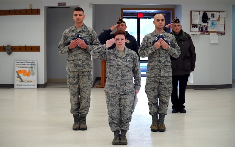 Base honor guardsmen and members of American Legion Post 6 offer a final salute during a ceremony for disposal of unserviceable flags Dec. 7, 2019, on Grand Forks Air Force Base, North Dakota. After being inspected and deemed unserviceable, the nearly 50 faded and worn flags were honorably burned. (U.S. Air Force photo by Senior Airman Elora J. Martinez)