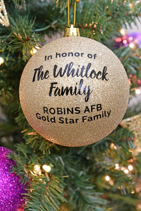 Picture shows a Gold Star family ornament on the Gold Star Holiday Tree for the Whitlock Family, a Gold Star family at Robins AFB.