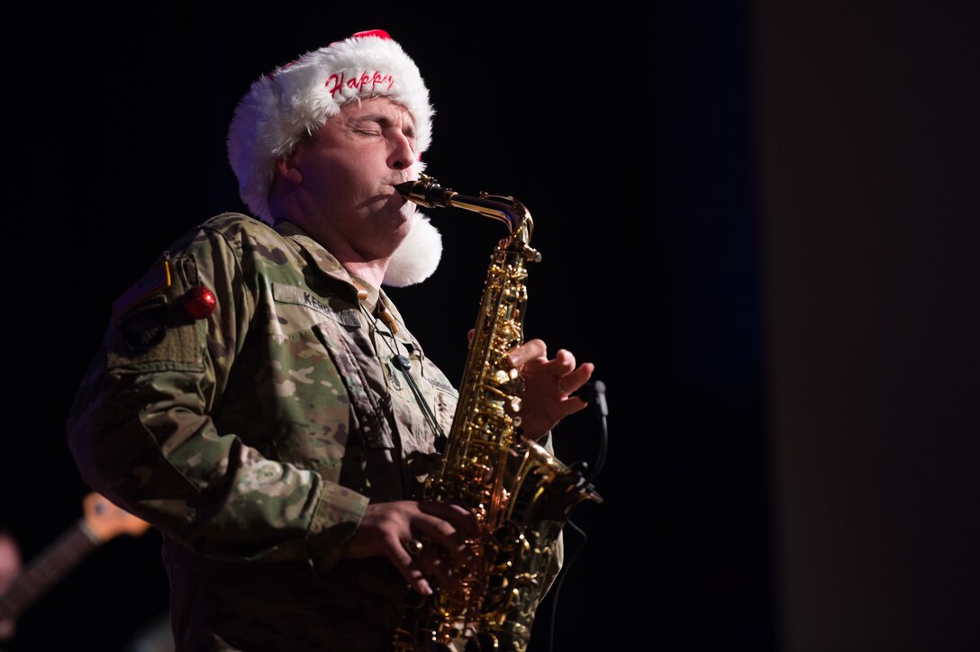 U.S. Army Staff Sgt. Timothy Kerr, U.S. Army Training and Doctrine Command Band saxophonist, plays the saxophone during their holiday concert at Joint Base Langley-Eustis, Virginia, Dec. 12, 2019.