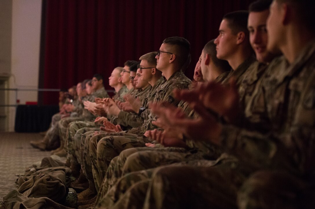 Students from the 128 Aviation Brigade students applaud during the U.S. Army Training and Doctrine Command Band holiday concert at Joint Base Langley-Eustis, Virginia, Dec. 12, 2019.