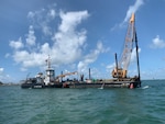 USCGC Smilax (WLIC-315), the oldest active U.S. Coast Guard cutter, travels through Hatteras Inlet. U.S. Coast Guard photo.