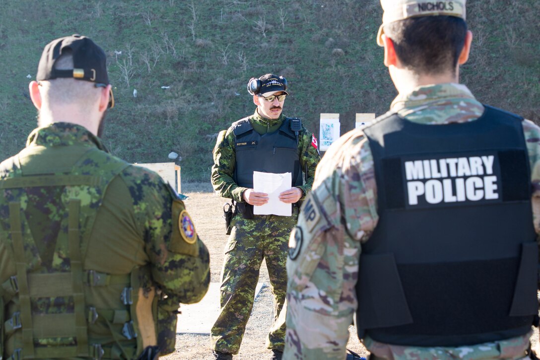 U.S. and Canadian military police conduct weapons training in Romania