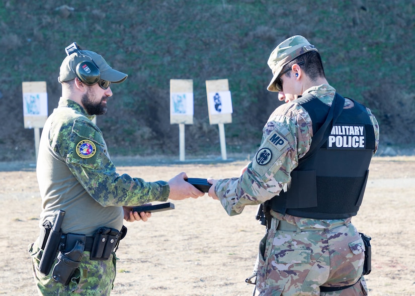 U.S. and Canadian military police conduct weapons training in