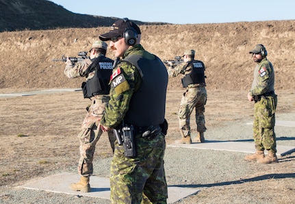 U.S. and Canadian military police conduct weapons training in Romania