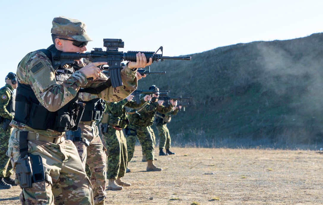 U.S. and Canadian military police conduct weapons training in Romania