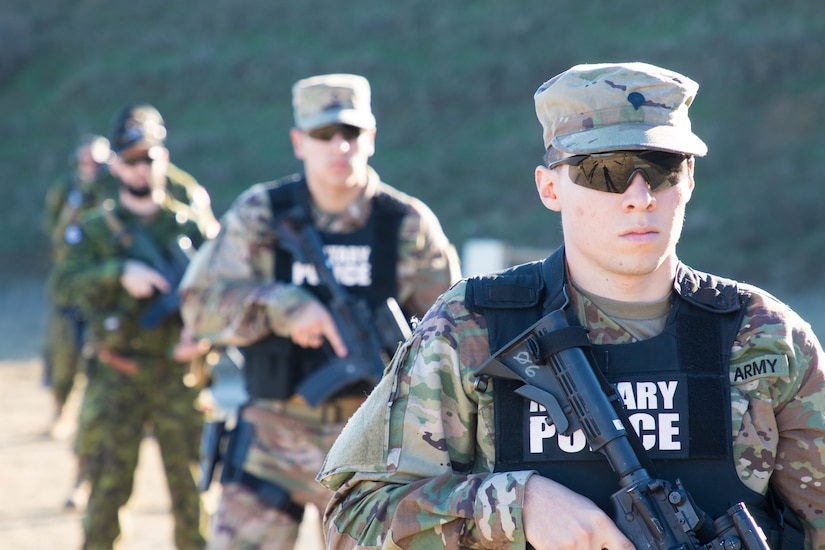 U.S. and Canadian military police conduct weapons training in