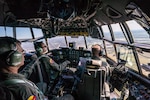 U.S. Air Force Maj. Ed Fattmann (center), a pilot assigned to the 180th Airlift Squadron, Missouri Air National Guard, takes his first flight as an aircraft commander with one eye, above St. Joseph, Missouri, Sept. 4, 2019.