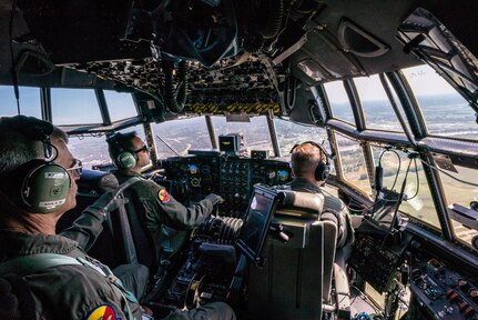 U.S. Air Force Maj. Ed Fattmann (center), a pilot assigned to the 180th Airlift Squadron, Missouri Air National Guard, takes his first flight as an aircraft commander with one eye, above St. Joseph, Missouri, Sept. 4, 2019.