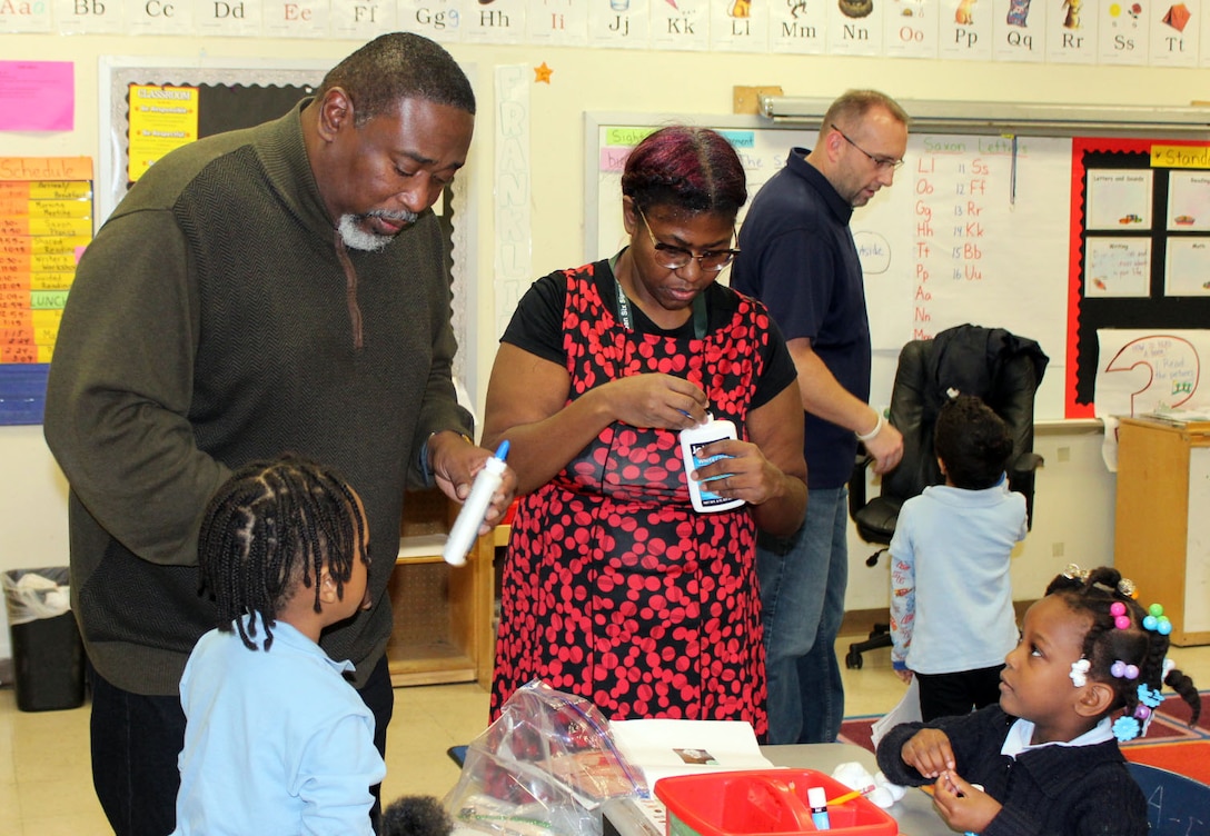 DLA Troop Support volunteers help students make ornaments during the DLA Troop Support Children’s Holiday Party Dec. 12, 2019 in Philadelphia.