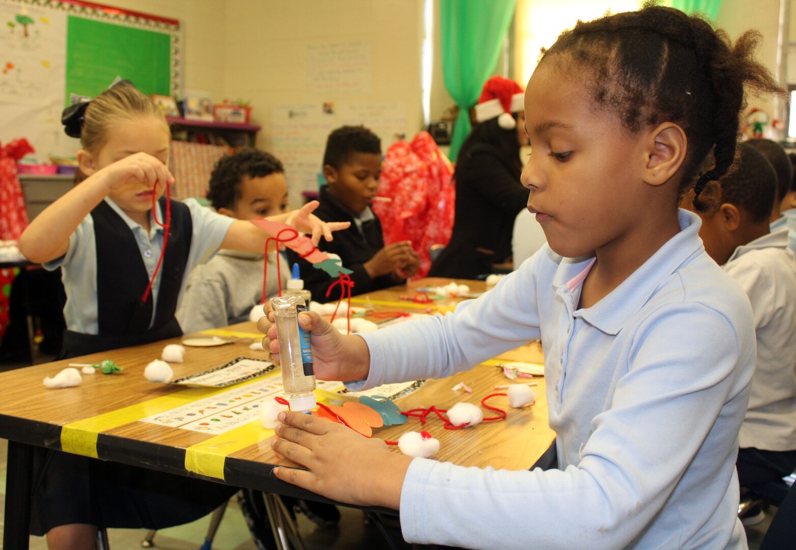 Benjamin Franklin Elementary School students make ornaments during the DLA Troop Support Children’s Holiday Party Dec. 12, 2019 in Philadelphia.
