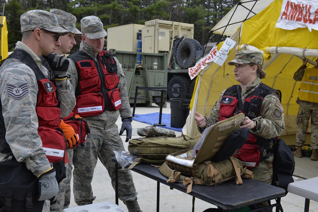 Tech. Sgt. Megan O’Regan, left, with the 157th Medical Group, Detachment 1, briefs fellow medics on medical supplies in preparation for a New England CERFP mass casualty exercise, Nov. 5. 2019, Brunswick, Maine. The exercise simulated the collapse of a chemical manufacturing building. (U.S. Air National Guard photo by Tech. Sgt. Aaron Vezeau)