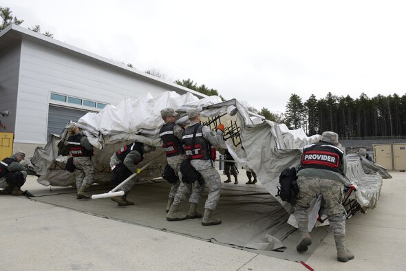 Airmen with the 157th Medical Group, Detachment 1, setup a mobile medical tent during a New England CERFP mass casualty training exercise, Nov. 5, 2019, Brunswick, Maine. The exercise simulated the collapse of a chemical manufacturing building. (U.S. Air National Guard photo by Tech. Sgt. Aaron Vezeau)