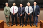 Human Resources Director Bill Shea, Systems Engineering Department Head Mike Thornton and retired Mechanical Engineer Gregory Harris received Department of the Navy Meritorious Civilian Service Awards from NSWC IHEODTD Commanding Officer Capt. Scott Kraft and Technical Director Ashley Johnson. Not pictured: Chemical, Biological and Radiological Defense Division Principal Engineer Bruce Corso. (U.S. Navy photo by Matt Poynor)