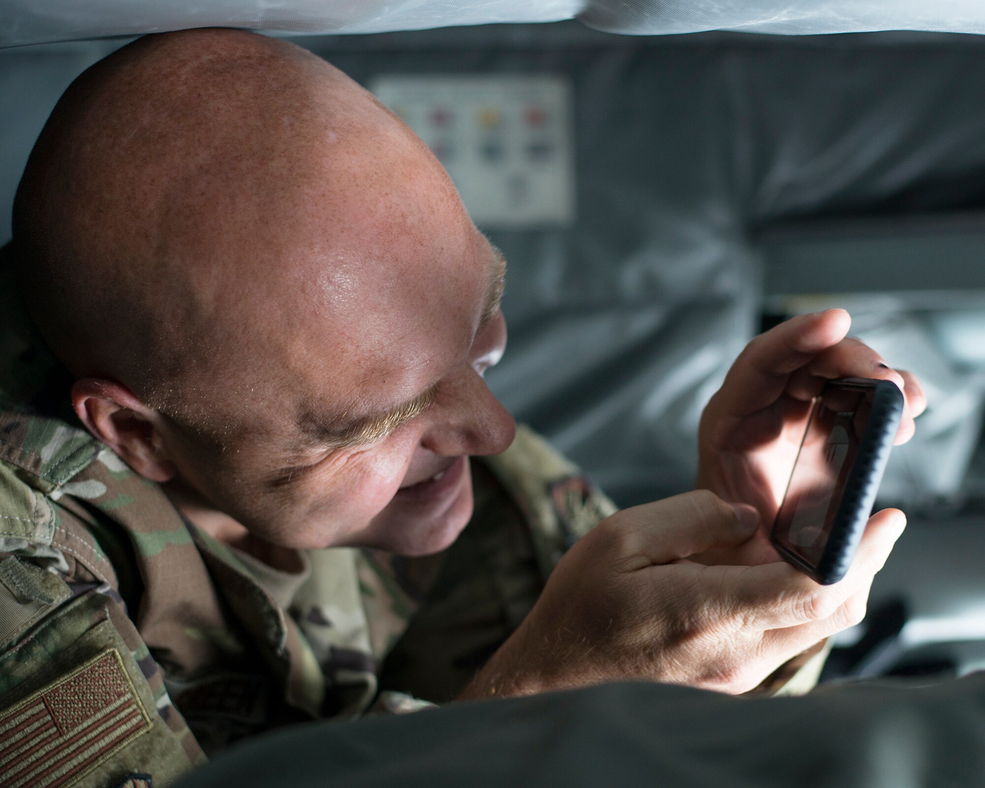 U.S. Air Force Chief Master Sgt. Anthony Green, the 6th Air Refueling Wing (ARW) command chief, takes a photo of an air refueling on a KC-135 Stratotanker aircraft assigned to MacDill Air Force Base, Fla., Dec. 17, 2019.