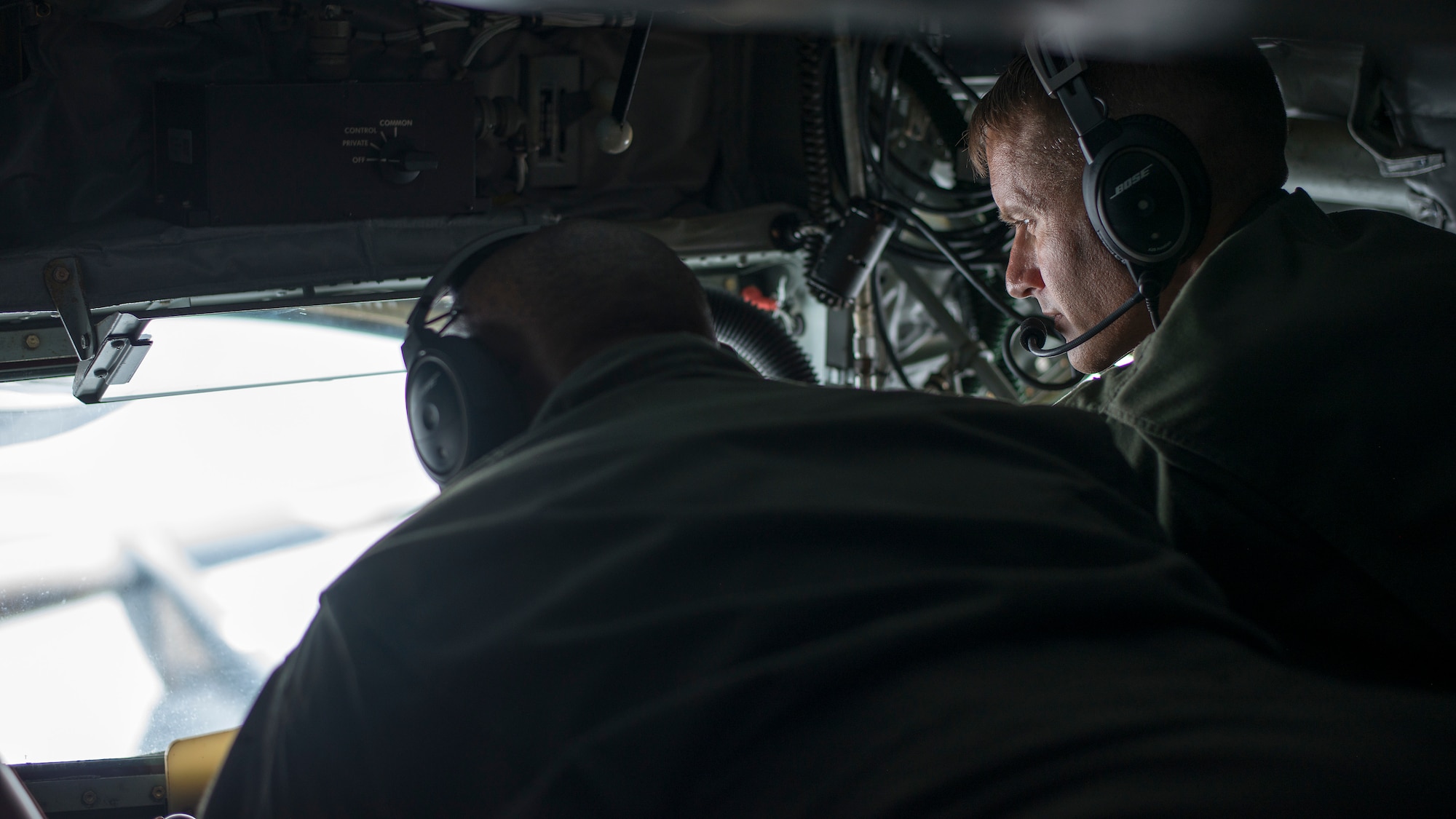 U.S. Air Force Col. Stephen Snelson, the 6th Air Refueling Wing (ARW) commander, views an air refueling by Tech Sgt. Joshua Foreman, a 50th Air Refueling Squadron boom operator, aboard a KC-135 Stratotanker aircraft, Dec. 17, 2019.