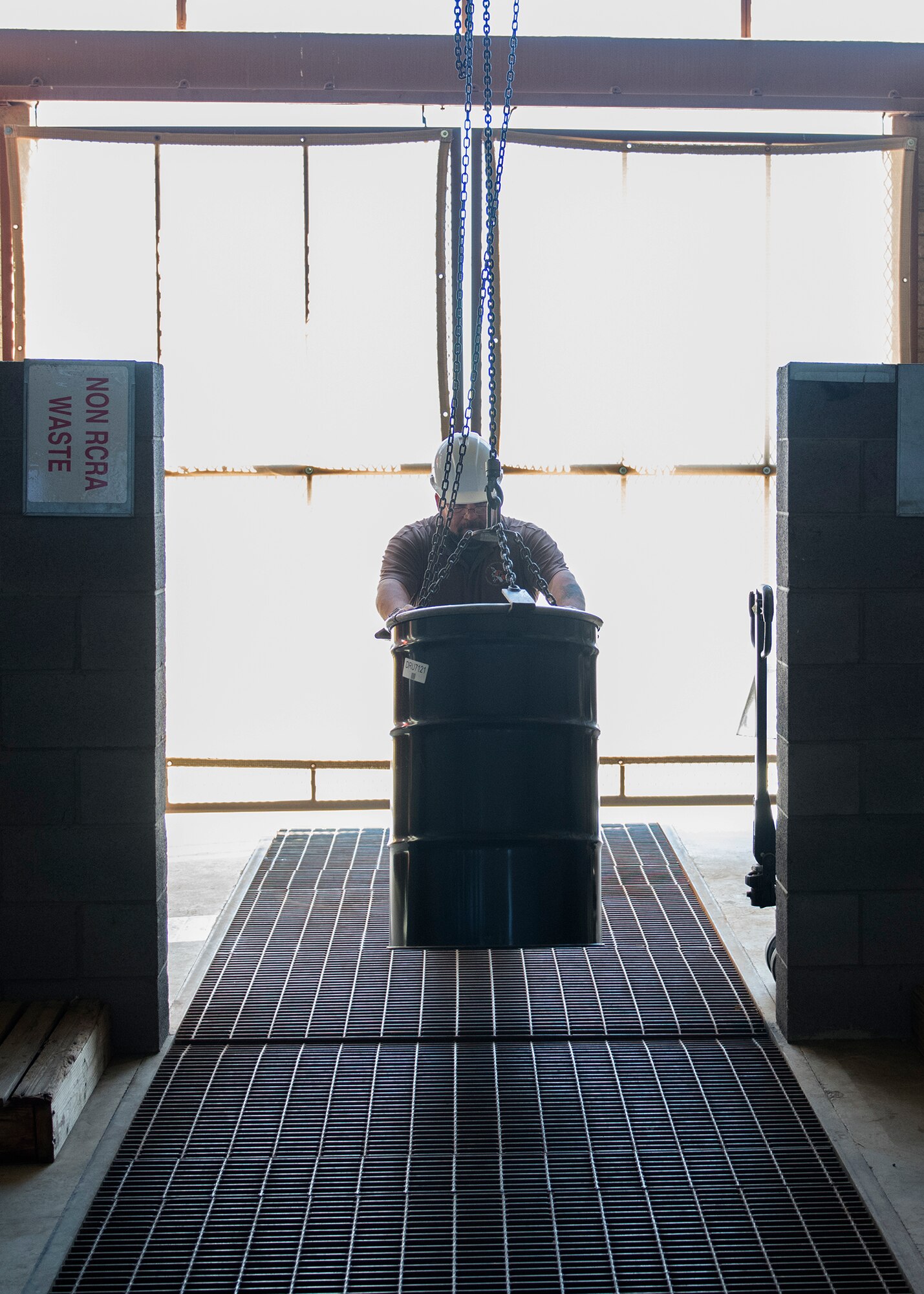 Carl Moser, 56th Civil Engineer Squadron environmental program manager, transports a drum filled with hazardous material Dec. 16, 2019, at Luke Air Force Base, Ariz.