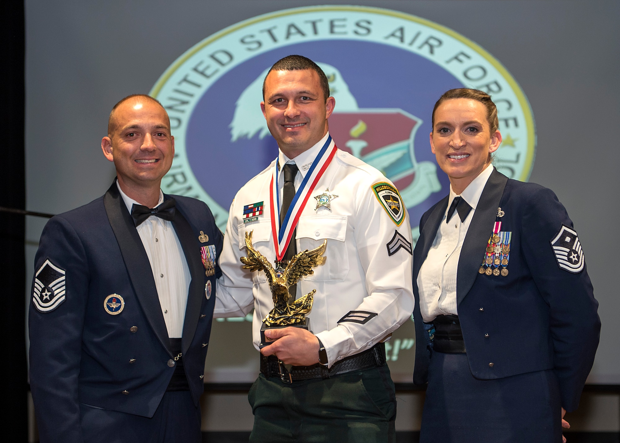 Hillsborough County Sherriff’s Office Cpl. Tommy Herr, accepts the Commandant Award during an Airman Leadership School (ALS) graduation at MacDill Air Force Base, Fla., Dec. 4, 2019.
