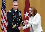 Amy Levine, analyst for DCTC, poses with Lt. Gen. Robert Ashley Jr. as she accepts the DIA Award for Meritorious Civilian Service