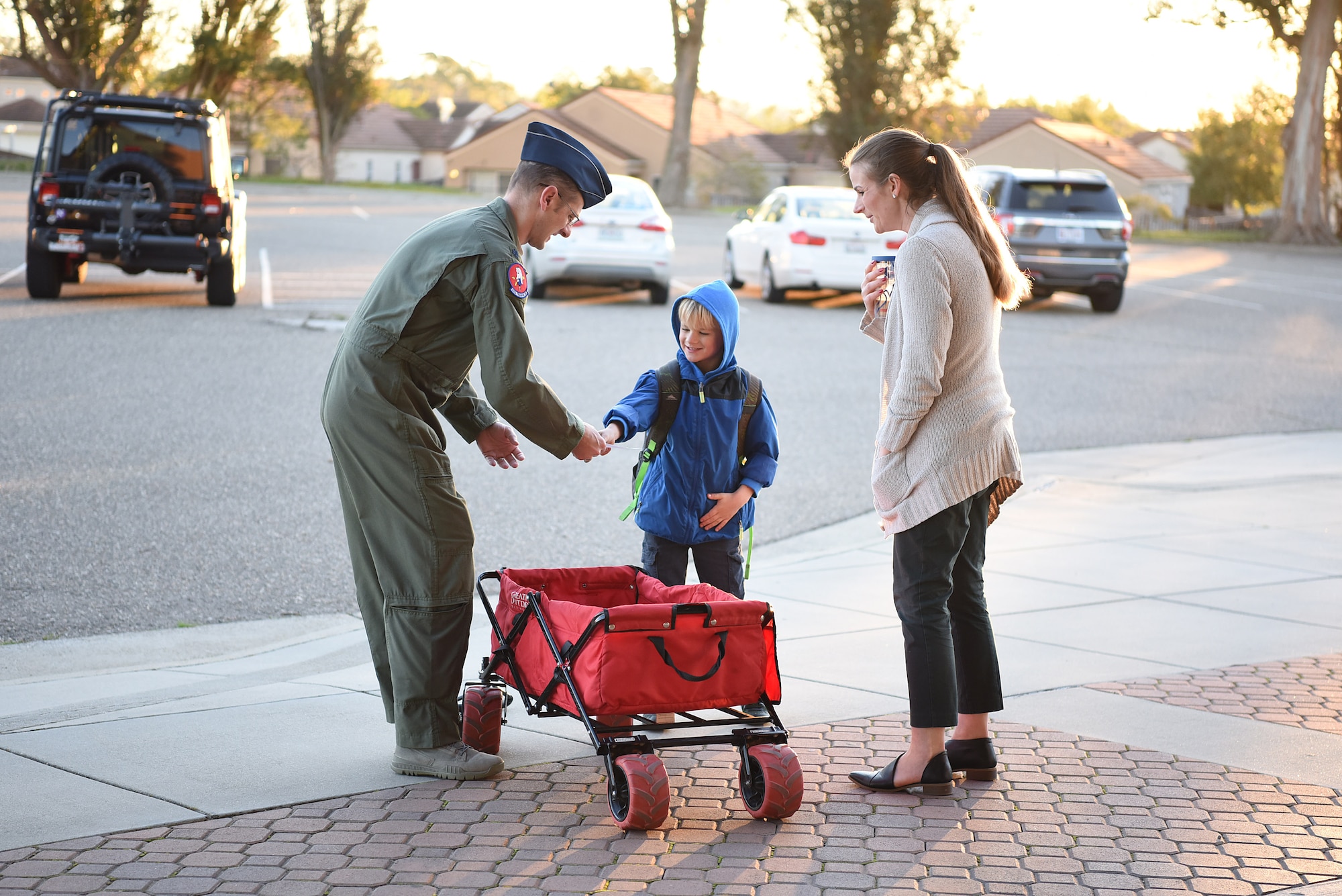 A Vandenberg Air Force Base Spouse’s Club member and her son collect cookies for the 2019 Cookie Drive Dec. 16, 2019, at VAFB, Calif. During this year’s drive, VAFB Spouse’s Club members packaged cookies in bags decorated by students from local schools and delivered the bags to Airmen across the base. (U.S. Air Force photo by Airman 1st Class Hanah Abercrombie)