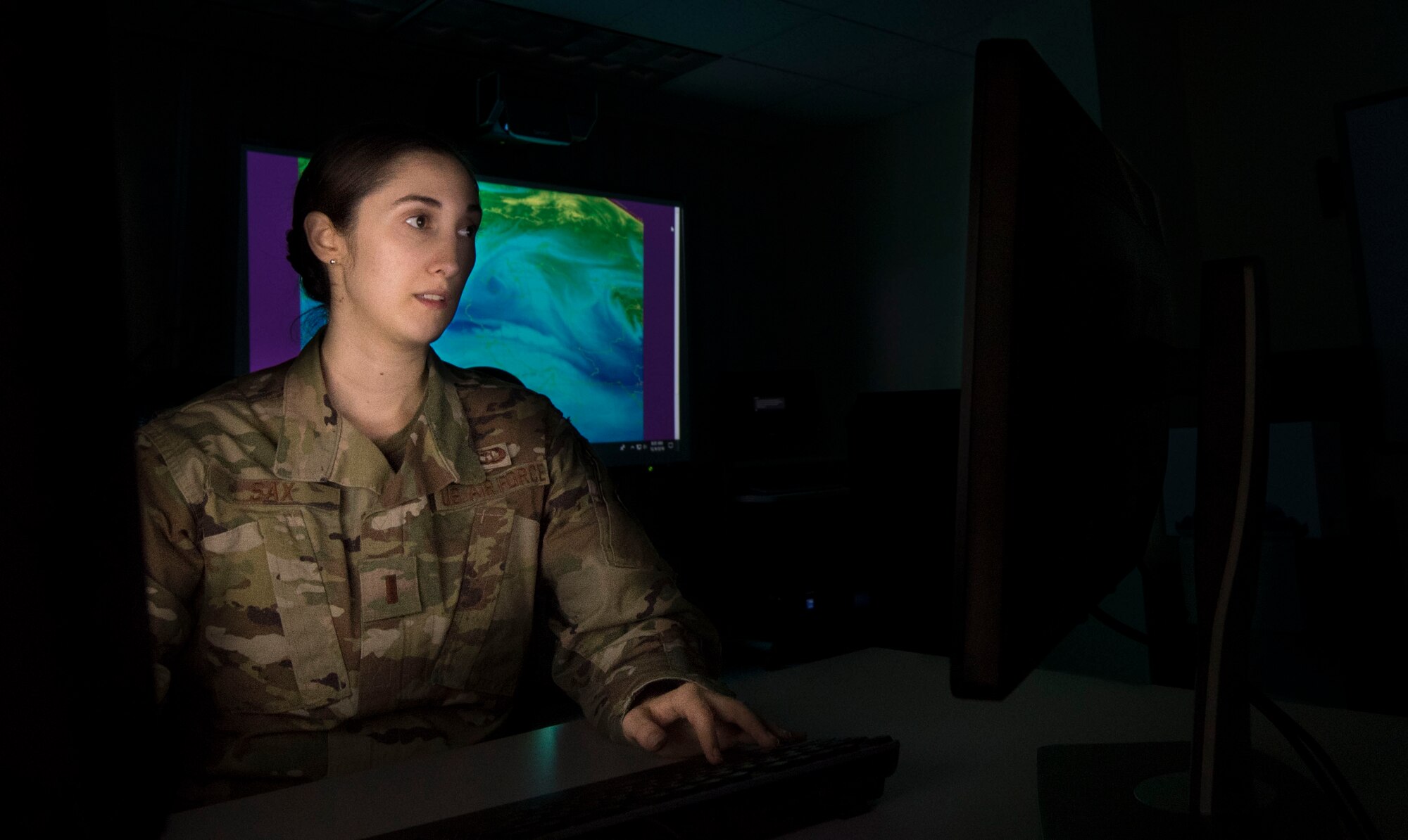 Photo of an Airman looking at a computer screen